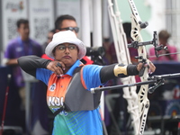 Deepika Kumari of India participates in the practice session before the competition against Li Jiaman of China (not in picture) on the first...