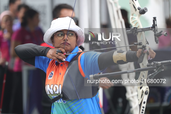 Deepika Kumari of India participates in the practice session before the competition against Li Jiaman of China (not in picture) on the first...