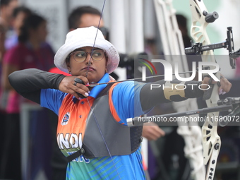 Deepika Kumari of India participates in the practice session before the competition against Li Jiaman of China (not in picture) on the first...