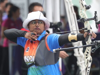 Deepika Kumari of India participates in the practice session before the competition against Li Jiaman of China (not in picture) on the first...