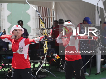 Li Jiaman and Yang Xialoei of China participate in the practice session before the competition on the first day of the Tlaxcala 2024 Archery...