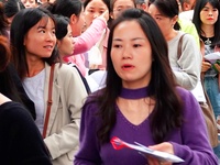 Candidates queue to enter the exam room during the 2024 National Adult College Entrance Examination in Yichang, Hubei province, China, on Oc...