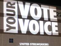 Waterford, MICHIGAN - OCTOBER 18: A message is projected on the side of the Oakland Expo Center where US Vice President and Democratic presi...