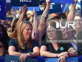 Waterford, MICHIGAN - OCTOBER 18: Attendees hold signs where US Vice President and Democratic presidential candidate Kamala Harris held the...