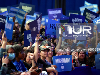 Waterford, MICHIGAN - OCTOBER 18: Attendees hold up signs where US Vice President and Democratic presidential candidate Kamala Harris held t...