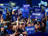 Waterford, MICHIGAN - OCTOBER 18: Attendees hold up signs where US Vice President and Democratic presidential candidate Kamala Harris held t...