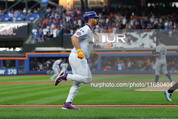 New York Mets player Pete Alonso #20 rounds the bases after hitting a home run during the first inning in Game 5 of the baseball NL Champion...