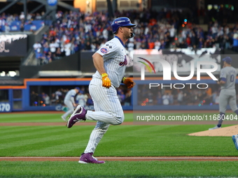 New York Mets player Pete Alonso #20 rounds the bases after hitting a home run during the first inning in Game 5 of the baseball NL Champion...