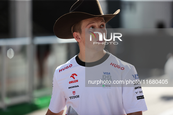 Liam Lawson wears a cowboy hat as he walks through the paddock at Circuit of the Americas in Austin, Texas, on October 18, 2024, during the...