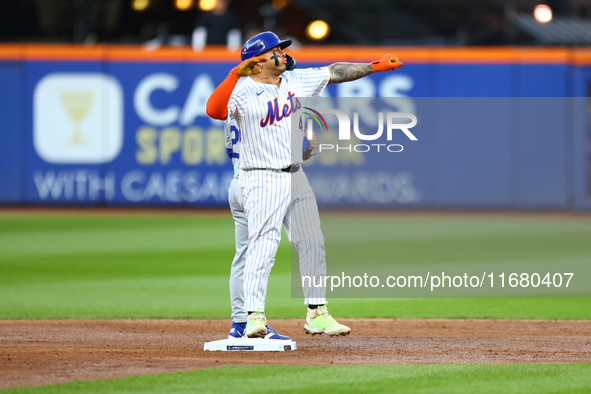 New York Mets player Francisco Alvarez #4 gestures after doubling during the second inning in Game 5 of the baseball NL Championship Series...