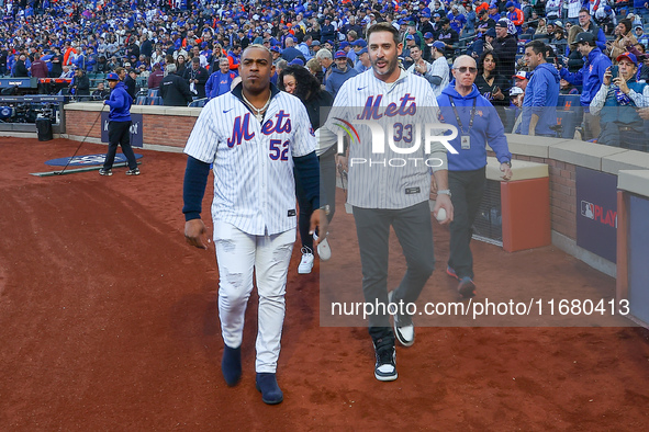 2015 NLCS Champion Matt Harvey throws out the ceremonial first pitch to fellow 2015 NLCS Champion Yoenis Cespedes before the baseball game b...