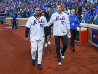 2015 NLCS Champion Matt Harvey throws out the ceremonial first pitch to fellow 2015 NLCS Champion Yoenis Cespedes before the baseball game b...