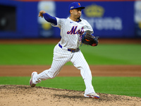 New York Mets relief pitcher Edwin Diaz #39 throws during the eighth inning in Game 5 of the baseball NL Championship Series against the Los...