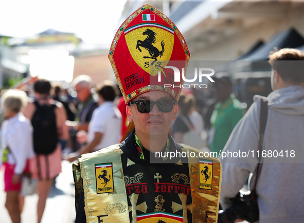 A Ferrari fan walks through the paddock at Circuit of the Americas in Austin, Texas, on October 18, 2024, during the Formula 1 Pirelli Unite...