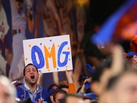 Fans hold up a sign during Game 5 of a baseball NL Division Series between the Los Angeles Dodgers and New York Mets at Citi Field in Flushi...