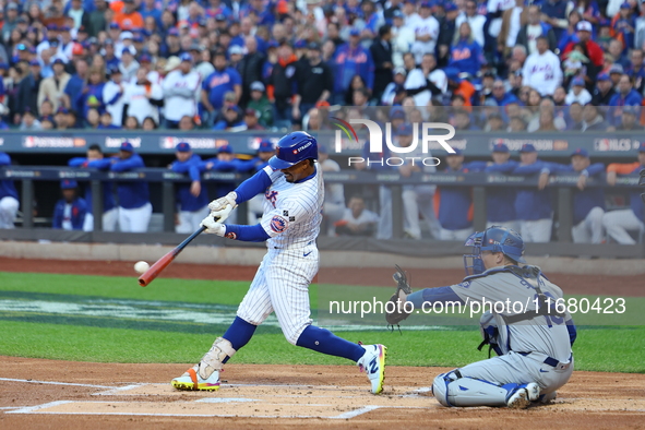 Francisco Lindor #12 of the New York Mets singles during the first inning in Game 5 of the baseball NL Championship Series against the Los A...