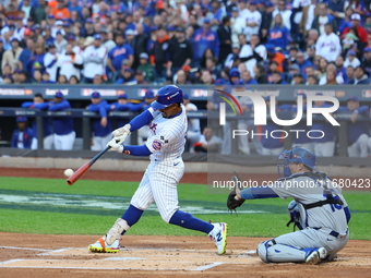 Francisco Lindor #12 of the New York Mets singles during the first inning in Game 5 of the baseball NL Championship Series against the Los A...