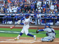 Francisco Lindor #12 of the New York Mets singles during the first inning in Game 5 of the baseball NL Championship Series against the Los A...