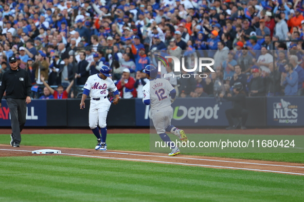 Francisco Lindor #12 of the New York Mets singles during the first inning in Game 5 of the baseball NL Championship Series against the Los A...