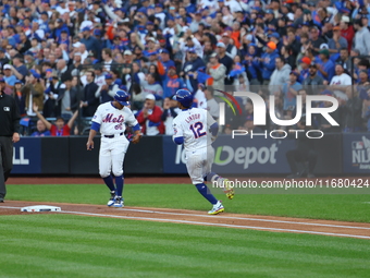 Francisco Lindor #12 of the New York Mets singles during the first inning in Game 5 of the baseball NL Championship Series against the Los A...