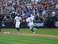 Francisco Lindor #12 of the New York Mets singles during the first inning in Game 5 of the baseball NL Championship Series against the Los A...