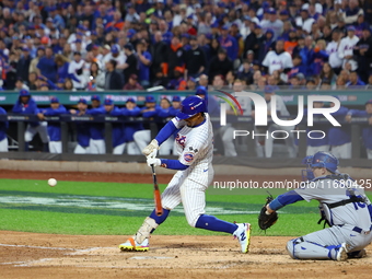 Francisco Lindor #12 of the New York Mets triples during the third inning in Game 5 of the baseball NL Championship Series against the Los A...