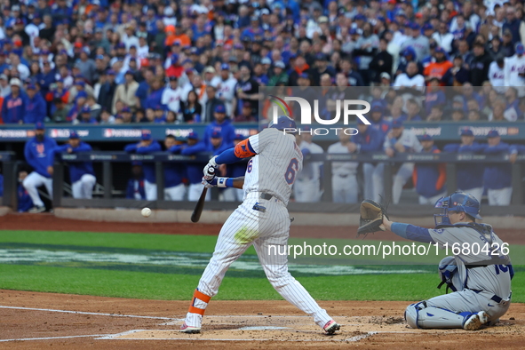 New York Mets' Starling Marte #6 doubles during the first inning in Game 5 of the baseball NL Championship Series against the Los Angeles Do...