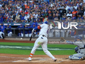 New York Mets' Starling Marte #6 doubles during the first inning in Game 5 of the baseball NL Championship Series against the Los Angeles Do...