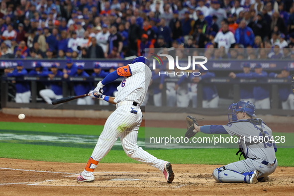 New York Mets' Starling Marte #6 doubles during the third inning in Game 5 of the baseball NL Championship Series against the Los Angeles Do...