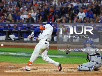 New York Mets' Starling Marte #6 doubles during the third inning in Game 5 of the baseball NL Championship Series against the Los Angeles Do...