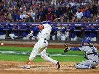 New York Mets' Starling Marte #6 doubles during the third inning in Game 5 of the baseball NL Championship Series against the Los Angeles Do...