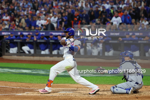 New York Mets' Starling Marte #6 doubles during the third inning in Game 5 of the baseball NL Championship Series against the Los Angeles Do...