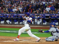 New York Mets' Starling Marte #6 doubles during the third inning in Game 5 of the baseball NL Championship Series against the Los Angeles Do...