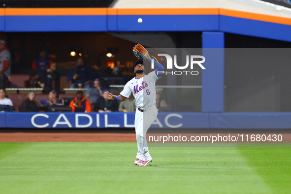 New York Mets right fielder Starling Marte #6 makes a catch during the third inning in Game 5 of the baseball NL Championship Series against...