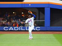 New York Mets right fielder Starling Marte #6 makes a catch during the third inning in Game 5 of the baseball NL Championship Series against...