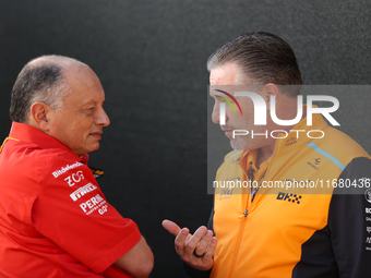 Frederic Vasseur and Zak Brown have a conversation next to the Ferrari hospitality suite at Circuit of the Americas in Austin, Texas, on Oct...