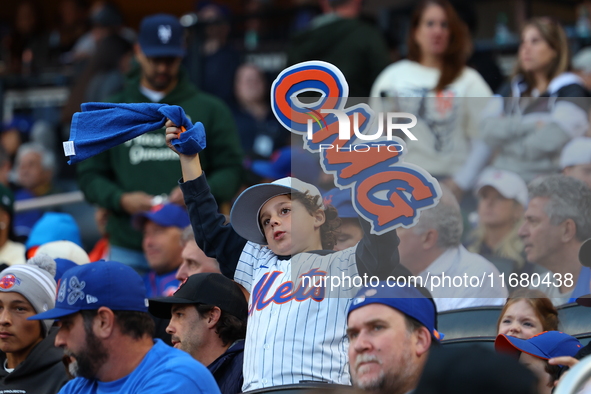 The New York Mets hold up an OMG sign during the first inning in Game 5 of the baseball NL Championship Series against the Los Angeles Dodge...