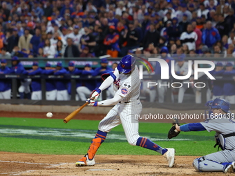 Brandon Nimmo #9 of the New York Mets singles during the third inning in Game 5 of the baseball NL Championship Series against the Los Angel...