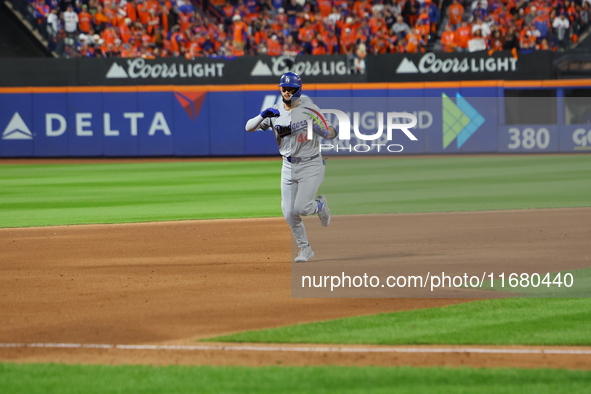 Los Angeles Dodgers player Andy Pages #44 rounds the bases after homering during the fifth inning in Game 5 of the baseball NL Championship...