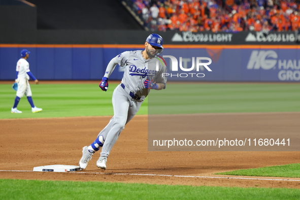 Los Angeles Dodgers player Andy Pages #44 rounds the bases after homering during the fifth inning in Game 5 of the baseball NL Championship...