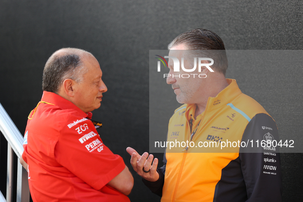 Frederic Vasseur and Zak Brown have a conversation next to the Ferrari hospitality suite at Circuit of the Americas in Austin, Texas, on Oct...