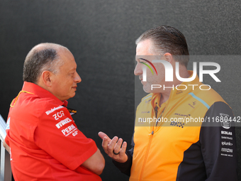 Frederic Vasseur and Zak Brown have a conversation next to the Ferrari hospitality suite at Circuit of the Americas in Austin, Texas, on Oct...