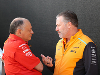 Frederic Vasseur and Zak Brown have a conversation next to the Ferrari hospitality suite at Circuit of the Americas in Austin, Texas, on Oct...