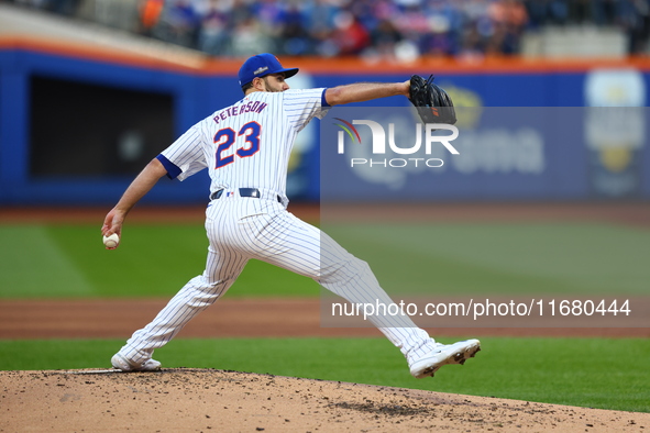 New York Mets starting pitcher David Peterson #23 throws during the first inning in Game 5 of the baseball NL Championship Series against th...