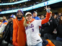 New York Mets fans sing ''Take Me Out to the Ball Game'' during the seventh inning stretch of the baseball game between the Los Angeles Dodg...