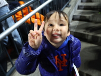 New York Mets fans sing ''Take Me Out to the Ball Game'' during the seventh inning stretch of the baseball game between the Los Angeles Dodg...