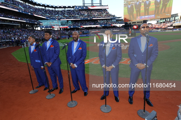 The Temptations sing the National Anthem on the field before Game 5 of a baseball NL Championship Series between the Los Angeles Dodgers and...