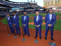 The Temptations sing the National Anthem on the field before Game 5 of a baseball NL Championship Series between the Los Angeles Dodgers and...