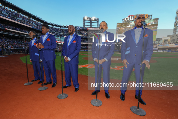 The Temptations sing the National Anthem on the field before Game 5 of a baseball NL Championship Series between the Los Angeles Dodgers and...