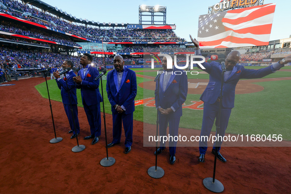 The Temptations sing the National Anthem on the field before Game 5 of a baseball NL Championship Series between the Los Angeles Dodgers and...